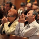 A couple prays at St. James Parish in Denver, March 30, 2014.